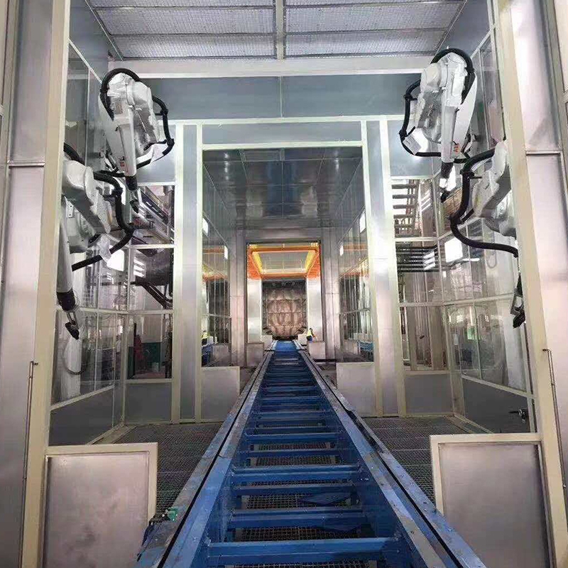 Ligne de revêtement par pulvérisation pour carters de moteur