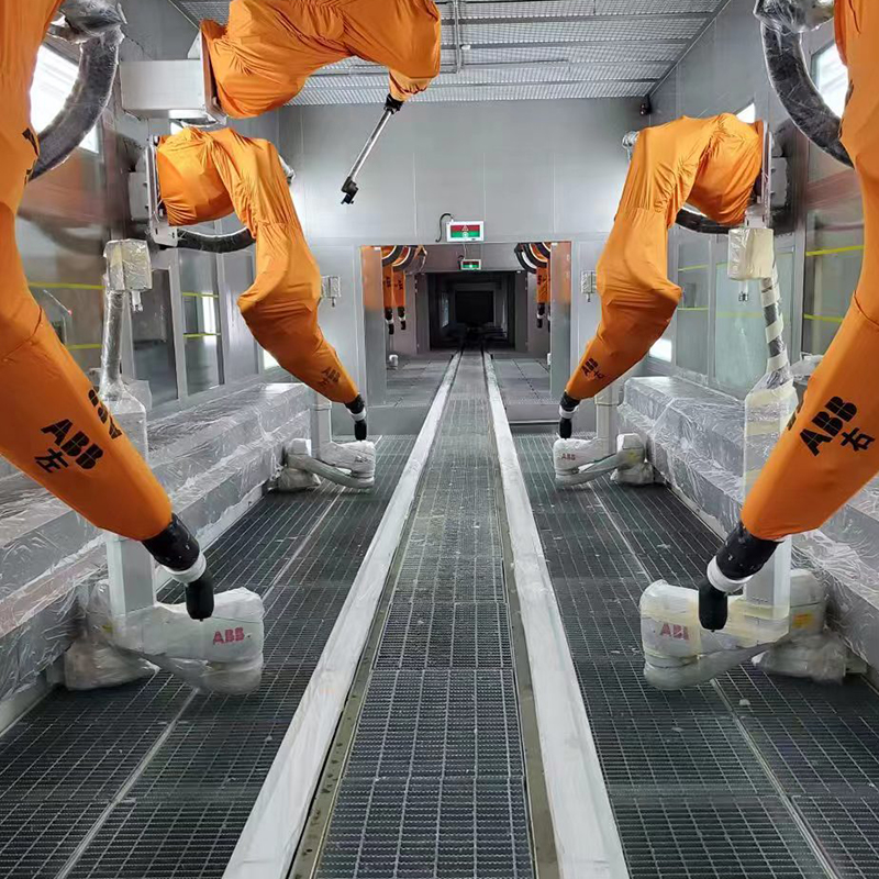 Ligne de revêtement par pulvérisation pour carters de moteur